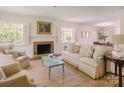 Bright living room features a cozy fireplace, neutral tones, and ample seating at 1184 Thornwell Ave, Rock Hill, SC 29732