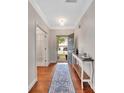 An entryway showcasing a hardwood floor, decoratively-designed rug, an open door, and a view of the front yard at 1225 Madison Green Dr, Fort Mill, SC 29715