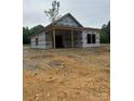 New construction home shows an inviting covered front porch at 128 Loblolly Dr, Mount Gilead, NC 27306