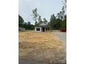 New home construction features a covered front porch and spacious yard, blank canvas at 128 Loblolly Dr, Mount Gilead, NC 27306