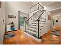 Spacious foyer features hardwood floors, staircase, and a view to the office at 144 Chickasaw Dr, Shelby, NC 28152