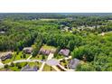 An aerial view of a lovely home nestled in a lush, green neighborhood surrounded by mature trees at 161 Leaning Tower Dr, Mooresville, NC 28117
