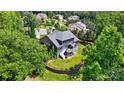 Aerial view of home showing a large deck and beautifully landscaped backyard with retaining wall at 161 Leaning Tower Dr, Mooresville, NC 28117