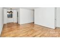 Open concept living room with hardwood floors and neutral wall color at 1809 Jameston Dr, Charlotte, NC 28209