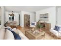 Bright and stylish living room with hardwood floors and comfortable furnishings at 1809 Jameston Dr, Charlotte, NC 28209