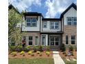 Beautiful brick townhome featuring well-manicured landscaping and inviting curb appeal at 3119 Beacon Heights Rd, Indian Land, SC 29707