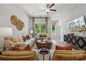Comfortable living room with large windows, modern decor, stylish furniture and hardwood floors at 3125 Beacon Heights Rd, Indian Land, SC 29707