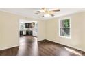 Bright dining room showcasing sleek, dark laminate flooring and an open view into the renovated kitchen at 315 Rivers St, Rock Hill, SC 29730
