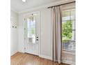 Bright entryway featuring hardwood floors, a decorative door, and ample natural light at 3801 Creek Ridge Dr, Denver, NC 28037