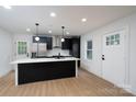 Bright kitchen with stainless steel appliances, white countertops, and black cabinetry at 4500 Ridgeley Dr, Charlotte, NC 28208