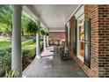 Spacious front porch with rocking chairs, offering a comfortable and relaxing outdoor space at 4920 Parview S Dr, Charlotte, NC 28226