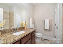Cozy bathroom featuring granite countertops, neutral wall paint, and a tiled shower and floor at 5214 Polo Gate Blvd, Charlotte, NC 28216