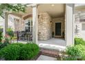 Charming front porch with stone pillars and black iron railings, leading to the front door at 5214 Polo Gate Blvd, Charlotte, NC 28216