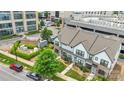 Stunning aerial view of the two-story townhome with lush landscaping in an urban community setting at 5946 Ardrey Kell Rd, Charlotte, NC 28277