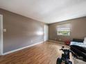 Cozy living room with natural light, laminate flooring, and neutral color scheme at 7977 Shady Oak Trl, Charlotte, NC 28210