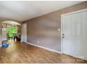 View of living room showing access to the dining room and front door at 7977 Shady Oak Trl, Charlotte, NC 28210