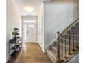 Bright foyer with hardwood floors, staircase, and front door at 809 River Park Rd, Belmont, NC 28012