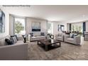 Spacious living room featuring modern furniture, large windows with natural light, and a dining area in view at 964 Pemberley St # 3193, Lancaster, SC 29720