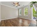 Inviting living area with hardwood floors, ceiling fan, and outdoor access at 110 Dime Ln, Mooresville, NC 28117