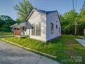 Angle view of cozy single-story home with fresh lawn and newly painted exterior at 123 Oak St, Chester, SC 29706