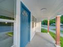 Inviting front porch with blue door and freshly painted exterior, leading into a cozy home at 123 Oak St, Chester, SC 29706