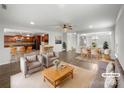 Open-concept living room flowing to the kitchen and dining area, virtually staged at 1814 Tradd Ave, Clover, SC 29710