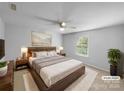 Neutral main bedroom featuring a large bed, nightstands, and soft natural light at 1814 Tradd Ave, Clover, SC 29710