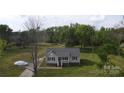 Charming one-story home with well-maintained lawn and inviting front porch at 1928 Londonberry Dr, Rock Hill, SC 29730