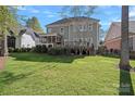Spacious backyard with a well-maintained lawn and a charming deck, perfect for outdoor relaxation and entertainment at 19679 Wooden Tee Dr, Davidson, NC 28036