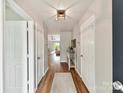 Inviting hallway with wood floors leading to an open-concept living space and plenty of light at 2005 Grimley Ln, Fort Mill, SC 29707