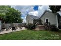 Backyard fire pit area and adjacent deck, great for relaxing outdoors at 303 N Main N St, Granite Quarry, NC 28146
