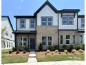 Charming townhouse featuring a mix of brick and siding, complemented by lush landscaping at 3117 Beacon Heights Rd, Indian Land, SC 29707