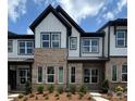Charming townhome featuring a brick and siding exterior with black trim accents at 3121 Beacon Heights Rd, Indian Land, SC 29707