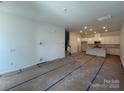 Spacious living room leading to the kitchen, ready for customization and personal touches at 3121 Beacon Heights Rd, Indian Land, SC 29707