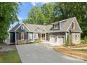 Beautiful two-story home featuring a two-car garage and a long concrete driveway at 434 Breezewood Dr, Belmont, NC 28012