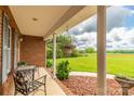 Relaxing front porch featuring comfortable seating, hanging plants, and scenic views at 4470 W Bandys Cross Rd, Claremont, NC 28610