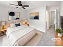 Serene main bedroom featuring soft carpeting, ceiling fan, and tasteful decor for a relaxing retreat at 6121 Dane Dr, Dallas, NC 28034
