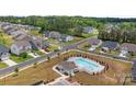 Beautiful aerial view of the neighborhood featuring a community pool and well-maintained homes at 7604 Tanglewood Way, Denver, NC 28037