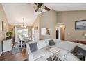 Cozy living room featuring a fireplace, an open layout to the dining area and hardwood floors at 8105 Castlemaine Dr, Matthews, NC 28104