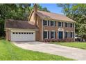 Beautiful brick home with a lush green lawn and a long driveway at 9001 Peyton Randolph Dr, Charlotte, NC 28277