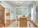 Bright dining room features hardwood floors, neutral walls, and a dining table for six at 916 Cadogan Ct, Fort Mill, SC 29708
