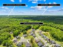 Aerial view showing quick access to I-485 and Uptown Charlotte amid lush greenery and neighborhood at 10901 Greenvale Dr, Harrisburg, NC 28075