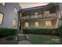 Inviting two-story condo building showcasing charming balconies, large windows, and well-maintained landscaping at 1121 Myrtle Ave # 72, Charlotte, NC 28203