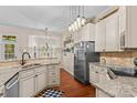 Spacious kitchen featuring stainless steel appliances, granite countertops, and a bay window at 149 Harbor Landing Dr, Mooresville, NC 28117