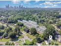An aerial shot reveals a vibrant community near the cityscape, surrounded by lush greenery and neighborhood streets at 158 Mattoon St, Charlotte, NC 28216