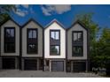 Modern townhomes featuring individual garages and a contemporary design at 158 Mattoon St, Charlotte, NC 28216