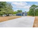 Lovely blue house with a long driveway and well-maintained landscaping at 251 Hall Spencer Rd, Catawba, SC 29704
