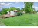 Side view of home showing the wooden deck and yard at 511 W Finger St, Maiden, NC 28650