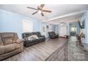 Spacious living room featuring a ceiling fan and vinyl floors at 511 W Finger St, Maiden, NC 28650