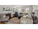 Cozy living room with fireplace, neutral colors, and plenty of natural light creating a warm atmosphere at 512 Forest Ln, Rock Hill, SC 29730